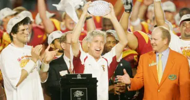 Pete Carroll hoists the national title trophy after his 2004 USC football team defeated Oklahoma in the Orange Bowl