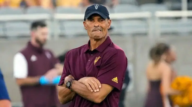 Herm-Edwards-arms folded