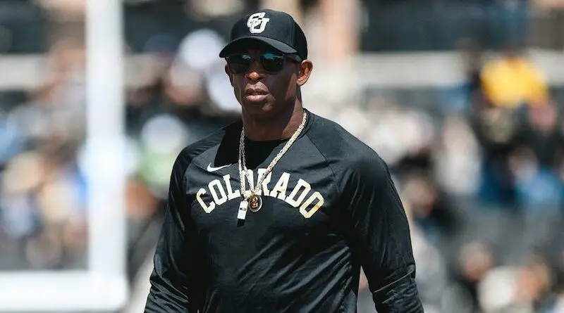deion sanders in colorado shirt and hat