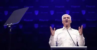 george kliavkoff speaking blue background