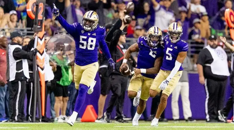 The University of Washington football team plays Stanford