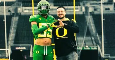 Elijah Rushing with Dan Lanning