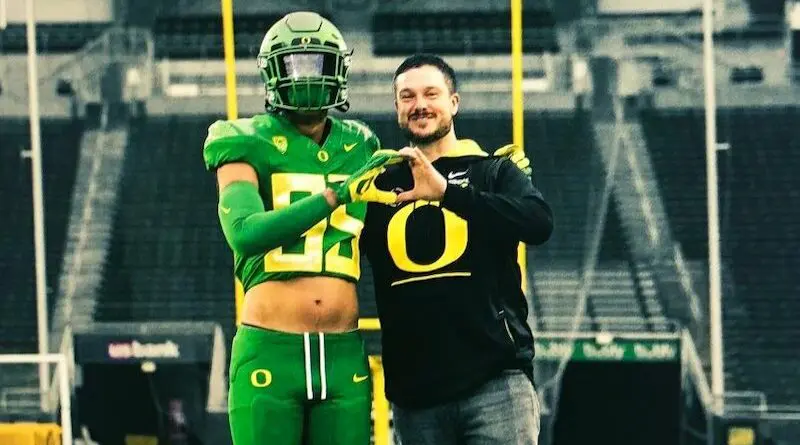 Elijah Rushing with Dan Lanning