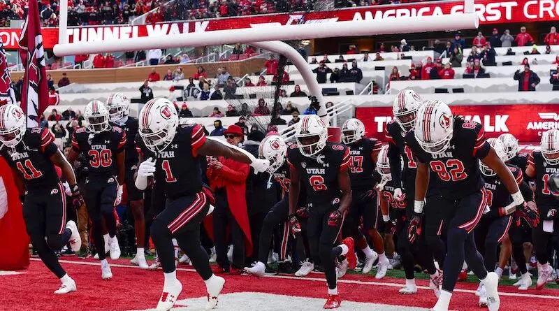 Utah Utes football players running out of the tunnel at Rice-Eccles