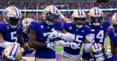 Washington Huskies football players celebrating