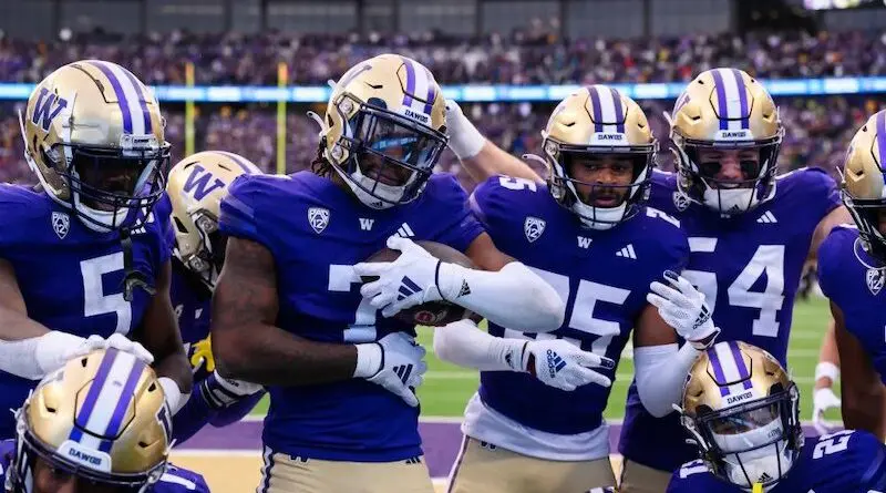 Washington Huskies football players celebrating