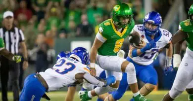 Oregon quarterback Dillon Gabriel runs with the ball against Boise State in 2024