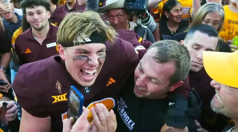 Kenny Dillingham and ASU players celebrate on field after defeating BYU in 2024
