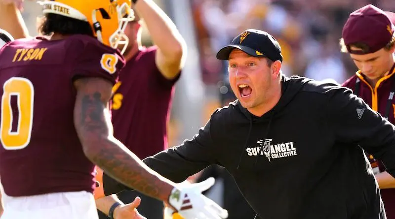 Kenny Dillingham celebrates with his players in 2024
