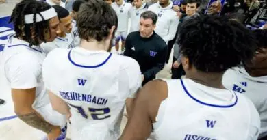 Danny Sprinkle with UW players