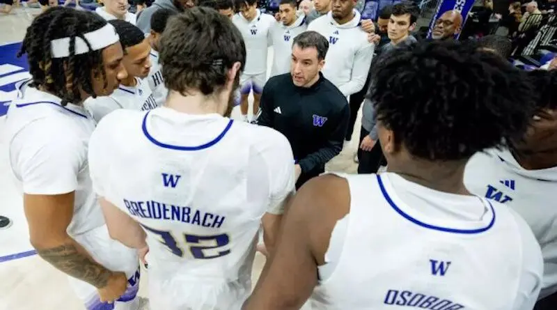 Danny Sprinkle with UW players