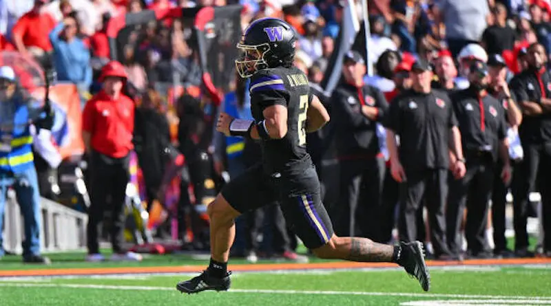 EL PASO, TEXAS - DECEMBER 31: Quarterback Demond Williams Jr. #2 of the Washington Huskies runs for a touchdown against the Louisville Cardinals during the first half of the Tony the Tiger Sun Bowl at Sun Bowl Stadium on December 31, 2024 in El Paso, Texas. The Cardinals defeated the Huskies 35-34.