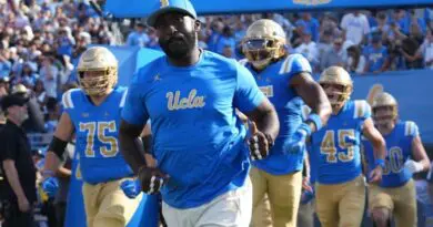 UCLA football head coach DeShaun Foster running out with team in 2024