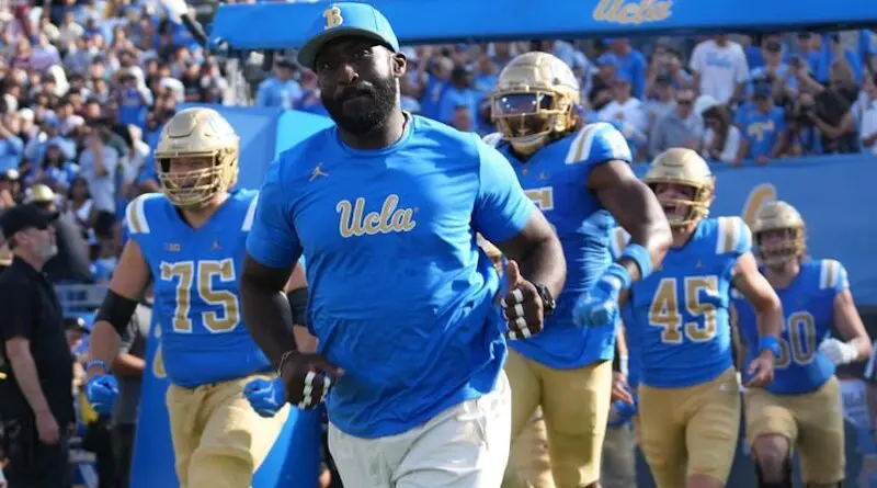 UCLA football head coach DeShaun Foster running out with team in 2024