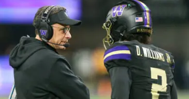 Washington football head coach Jedd Fisch with Husky QB Demond Williams Jr.