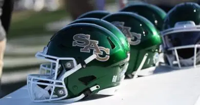 Green Sacramento State football helmets