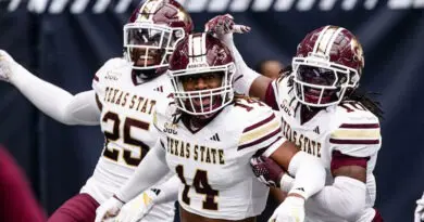 Texas State football players celebrating