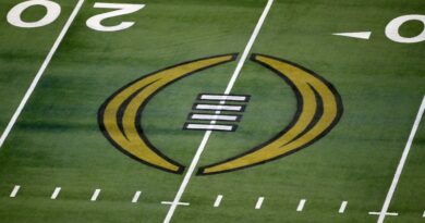 College Football Playoff logo on the field