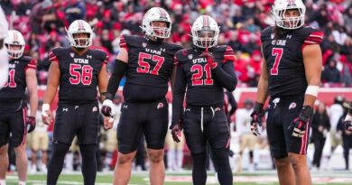 Utah football players standing on the field