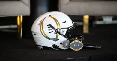 College Football Playoff logo on helmet and microphone