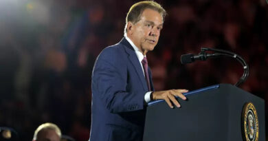 Former Alabama football head coach Nick Saban speaking at the presidential podium.