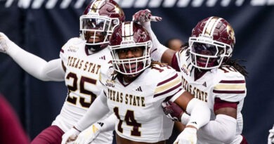 Texas State football players celebrating