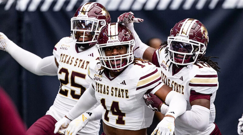 Texas State football players celebrating