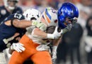 Penn State linebacker Tony Rojas reaches to stop Boise State tight end Matt Lauter during the Fiesta Bowl. Lauter and the Broncos will open the 2025 season on a Thursday night in August.