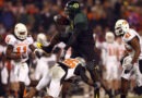 Oregon's LeGarrette Blount hurdles a Cowboy player en route to a touchdown a 42-31 win over Oklahoma State in 2008