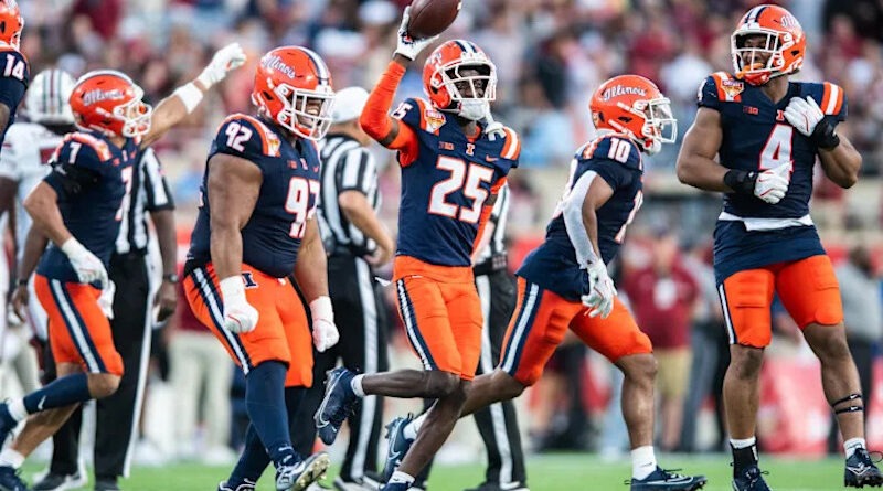 Illinois Fighting Illini defensive back Jaheim Clarke (25) celebrates his fumble recovery against the South Carolina Gamecocks in the third quarter at Camping World Stadium. Mandatory Credit: Jeremy Reper-Imagn Images