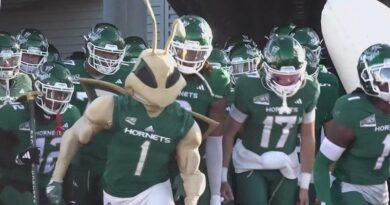 Sacramento State football with Hornet Mascot