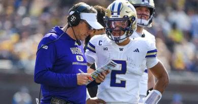 Washington football head coach Jedd Fisch and Demond Williams Jr